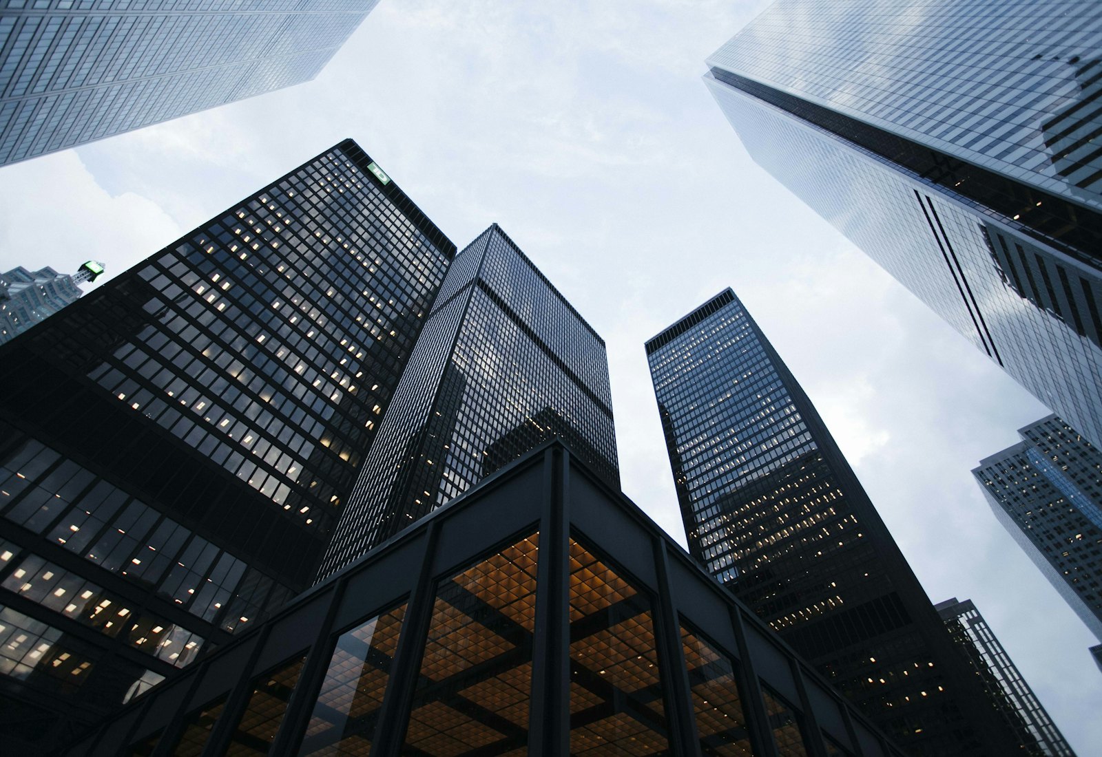 Black and white photograph of financial district towers seen from street level